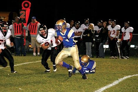 Nick Ianniello/Mineral Independent Superior Bobcat Travis Stroot pushes through the Pirates defense during the third quarter of their game Friday night.