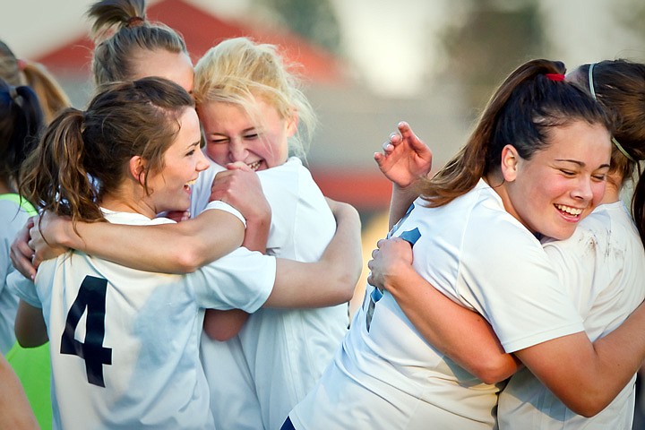 &lt;p&gt;Timberlake High's Traci Wall hugs her teammate as the rest of her team celebrates their win against Kellogg High in the 3A Region 1 tournament championship game Thursday in Rathdrum.&lt;/p&gt;