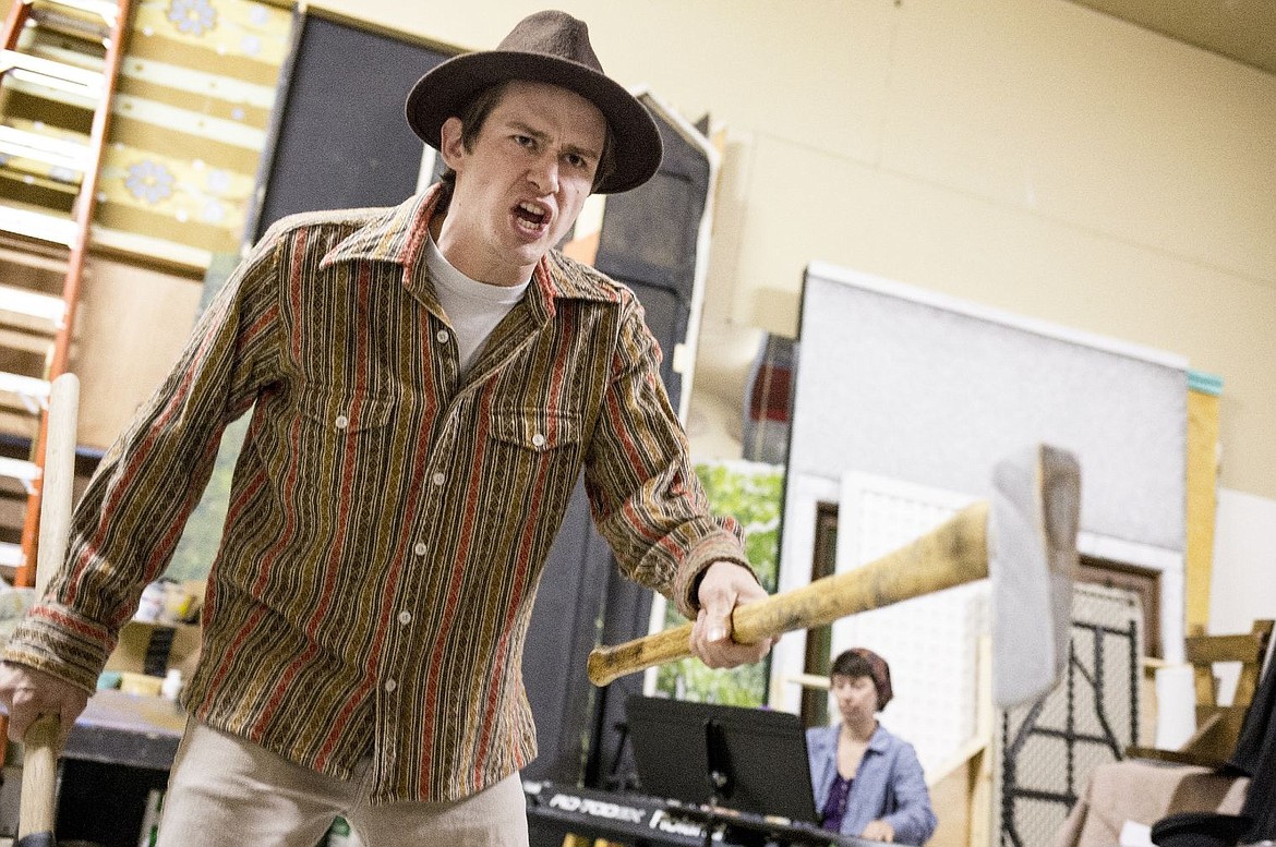 &lt;p&gt;Cody Bray wields an ax while Jenny Twitchell plays piano to accompany his singing while rehearsing a scene from the musical &quot;Living Through the Fire,&quot; on Monday at Coeur d'Alene Summer Theater in Coeur d'Alene.&lt;/p&gt;