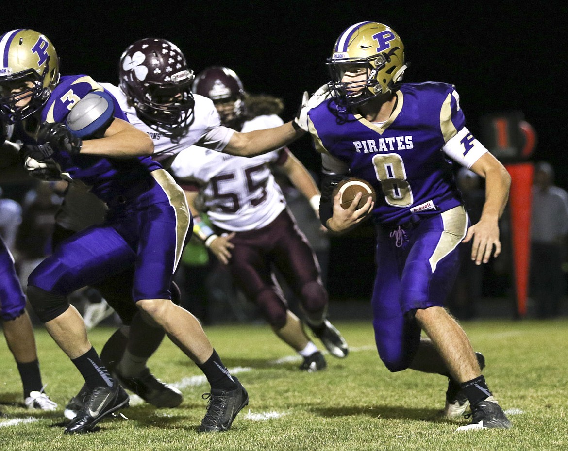 &lt;p&gt;Polson's Tanner Wilson runs behind his blockers on Friday night in Polson.&lt;/p&gt;