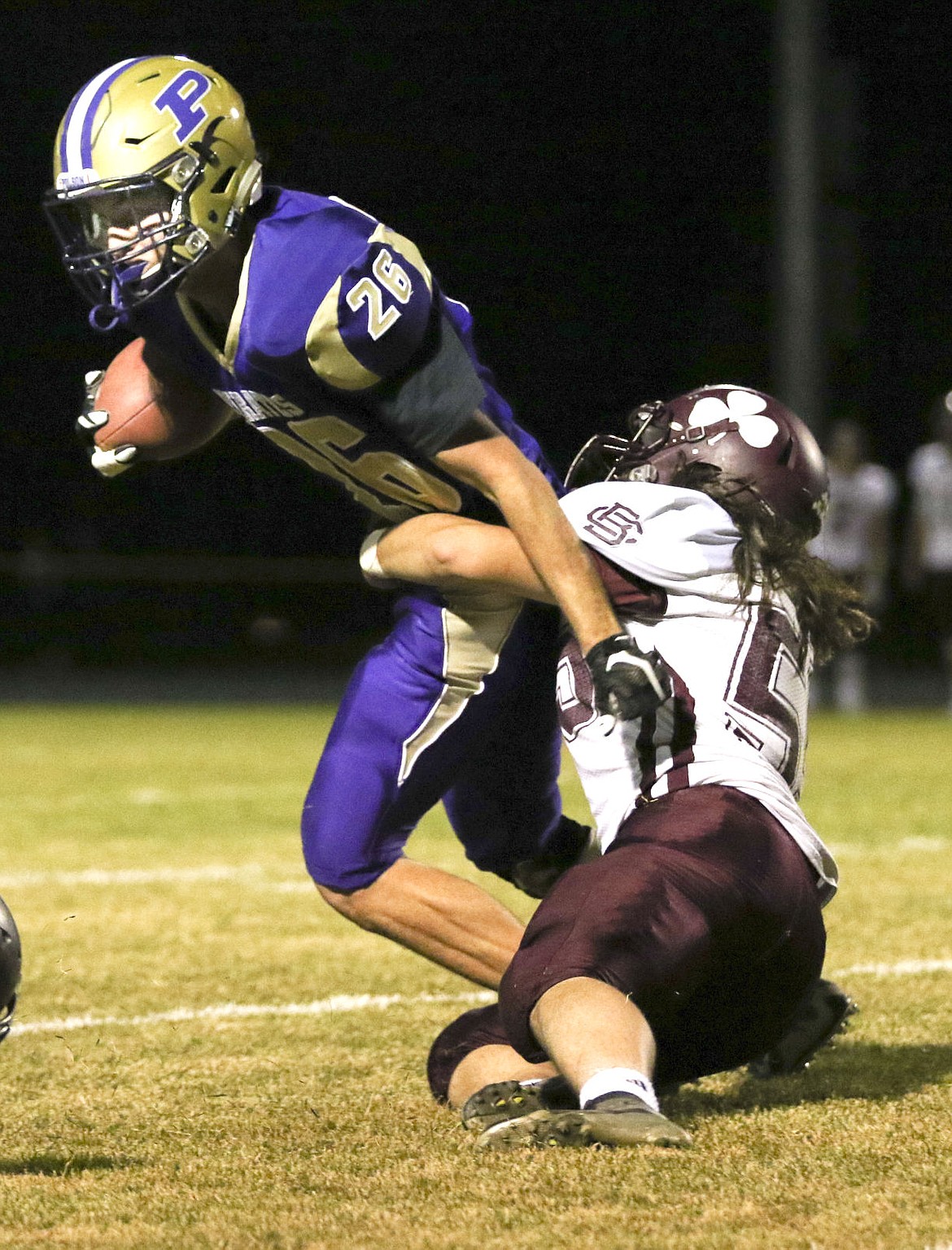 &lt;p&gt;Polson's Hudson Smith breaks a tackle from a Butte Central defender on Friday night.&lt;/p&gt;