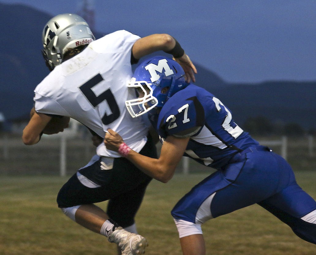 &lt;p&gt;Mission's Kaleb Durglo tries to take down Anaconda's Kaden Weis on Friday night in St. Ignatius.&lt;/p&gt;