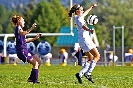 &lt;p&gt;Lake City High's Maddi Ward makes a stop on the ball in front of Emilee Wiggin from Lewiston High during the first half of Saturday's 5A Region 1 championship game.&lt;/p&gt;