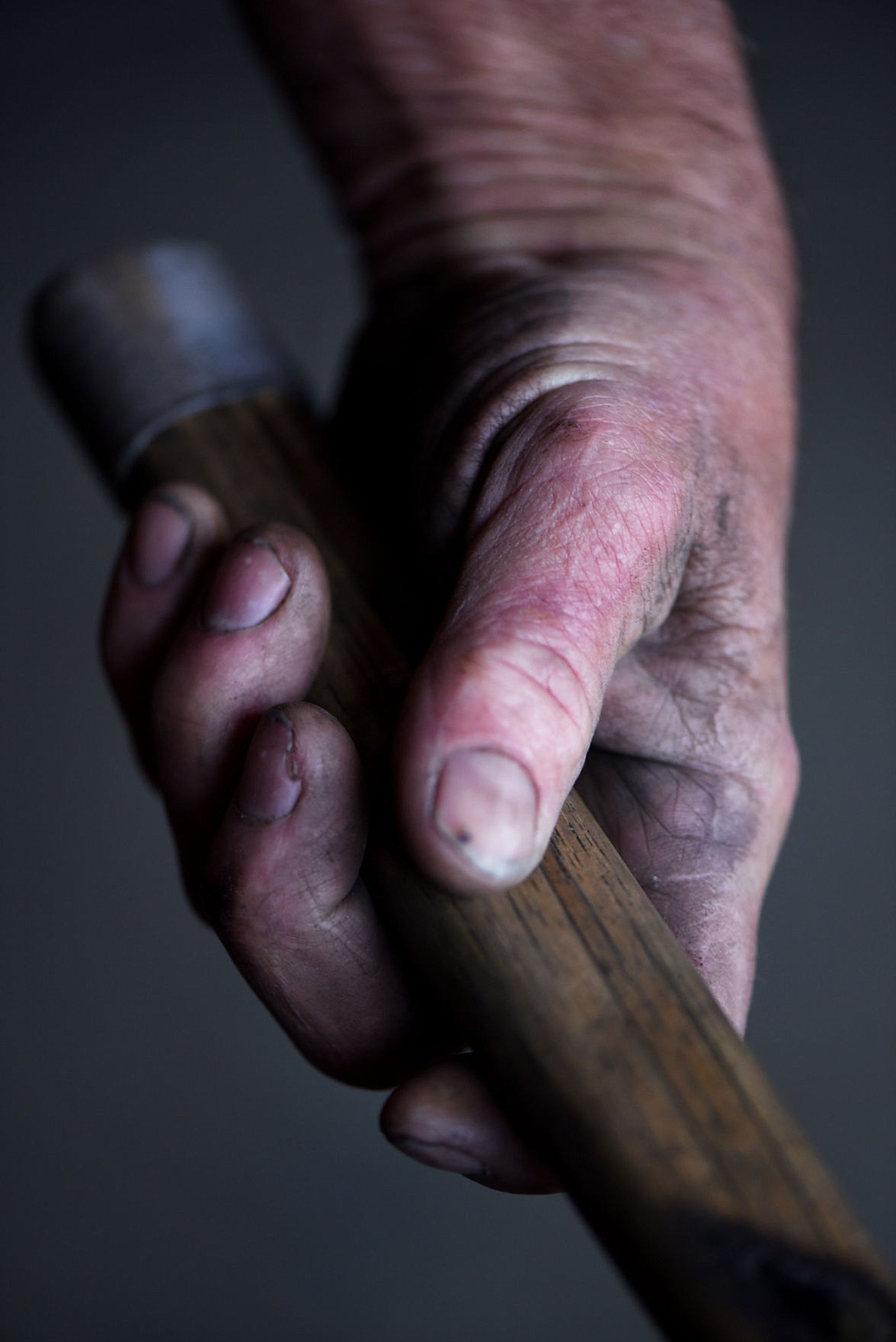 <p>The lines in Rick Schmidt's hands are deep and show up easily in the dust that comes from working with in the shop. In his hands he has more than 250 stitches from accidents major and minor over the years. His right index finger is mostly numb. (Brenda Ahearn/Daily Inter Lake)</p>