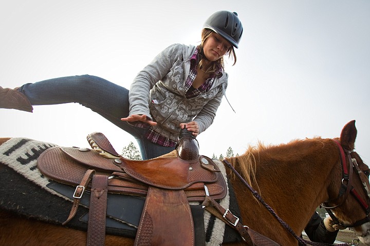 &lt;p&gt;Coeur d'Alene High sophomore, Marina Thaxton, saddles up on Sunny prior to a riding lesson at Bridal Path Stables in Hayden during a field trip Thursday with the school's environmental science class.&lt;/p&gt;