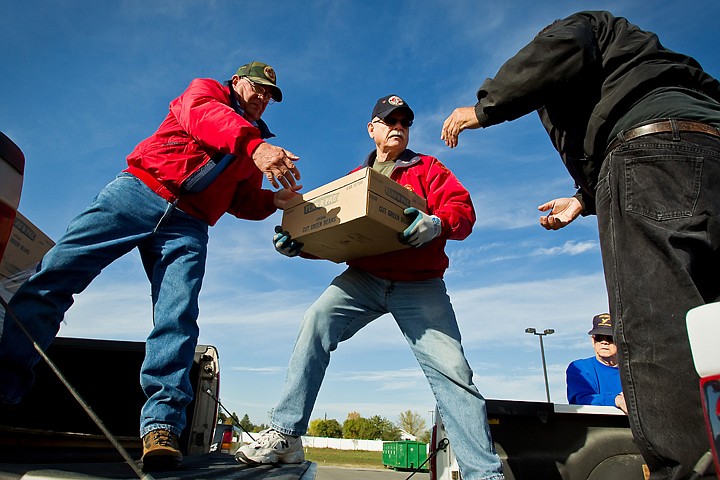 &lt;p&gt;JEROME A. POLLOS/Press Tom Wambolt, left, and Duke Gaffney, both with the Pappy Boyington Detachment of the Marine Corps League, helps Dave Sheridan, with American Legion Post 14 in Coeur d'Alene, load his truck Thursday with more than 1,000 pounds of canned vegetable that will be delivered to the State Veterans Home in Lewiston. John Dunlap, American Legion Post 143 commander, organized the unloading and packing from the Post Falls location. The effort was coordinated by local veterans groups which have been making the annual 100-mile-plus convoy south with about $5,000 worth of food for the past 21 years.&lt;/p&gt;