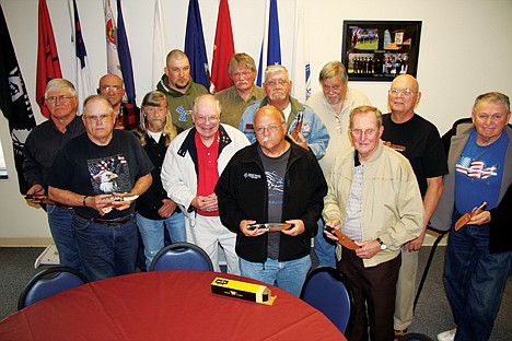 &lt;p&gt;Graham Crutchfield, center in red shirt, presented Buck Knives Vietnam veterans or family members during a special ceremony Saturday at the American Legion in Post Falls. Front row from left: Dave Blanton, Crutchfield, Jim Hunt and Ray Rooper. Second row from left: Gabe Komanec, Jim Coleman, John Doherty, Paul Sherman and Dale Inman. Back row from left: John Ivy, Eric Stroh, Bob Barnett and Ross Jackman. (Photo by BILL BULEY/HNN)&lt;/p&gt;