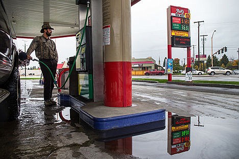 &lt;p&gt;Jason Johnson, of Sandpoint, pumps gas into his truck at the A-N-D Mini Mart on North 4th Street and East Best Avenue on Wednesday afternoon. Gas prices have dropped by .28 cents in the past month. &#147;I come down to Coeur d&#146;Alene to fill up because gas prices are lower here,&#148; Johnson said.&lt;/p&gt;