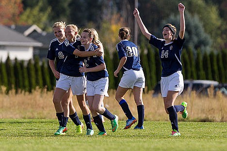 &lt;p&gt;Billie Shuster (14) and her Timberlake teammates celebrate after winning the 3A District 1-2 Championship game 1-0 against Coeur d&#146;Alene Charter Academy at the Community United Methodist Church on Thursday afternoon.&lt;/p&gt;