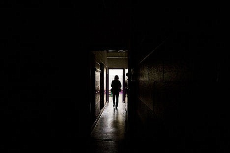 &lt;p&gt;Kika Morelan, an investigator with Spokane Paranormal Investigation Group, takes readings in the boys shower area of a locker room just a few feet from where medium Jennifer Von Behren saw the ghost figure of a young male Thursday at the Mullan Athletic Pavillion.&lt;/p&gt;