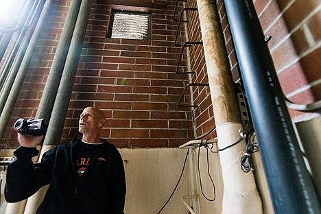 &lt;p&gt;Scott Mercer, paranormal investigator, uses a specialized video camera in an attempt to record spirit energies in the boiler room of the Mullan Athletic Pavillion.&lt;/p&gt;