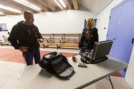 &lt;p&gt;Paranormal investigators Scott Mercer, left, and Kika Morelan prepare their gear before searching the pavilion for ghostly activity.&lt;/p&gt;