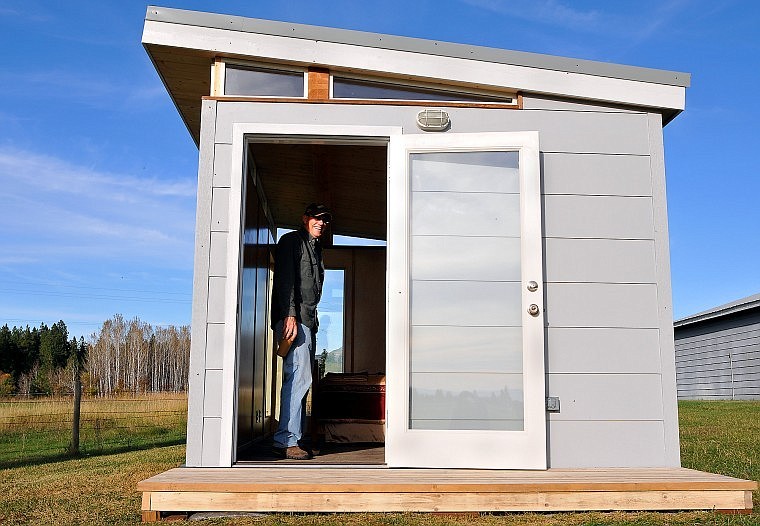 Brad Bjerken, an independent contractor for the Seattle-based company Modern-Shed, stands in his office space, a Modern-Shed building, in his backyard in Columbia Falls.