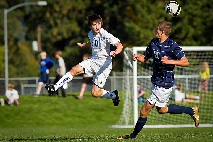 &lt;p&gt;Coeur d'Alene High's Justin Doering remains airborne after making a play on the ball in front of Lake City's Lenny Beckmann during the 5A Region 1 championship game Saturday.&lt;/p&gt;