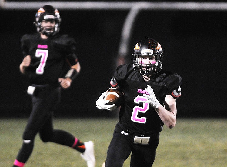 &lt;p&gt;Flathead's Seth Adolph turns upfield after catching a pass from Bridger Johnson during the second quarter against Capital on Friday. (Aaric Bryan/Daily Inter Lake)&lt;/p&gt;