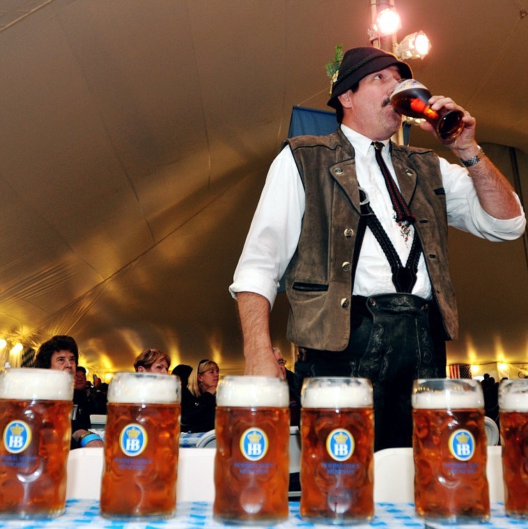 Mike McNamara takes a drink before the start of the stein-holding competition.