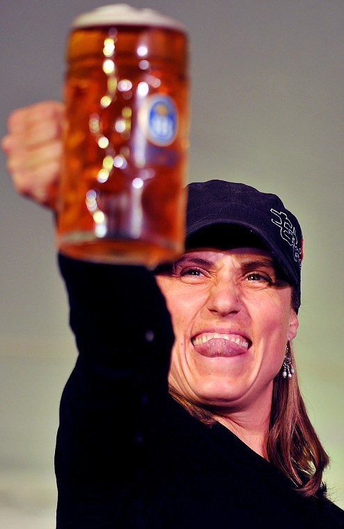 Sarah Peterson focuses on holding a container of beer during the stein-holding competition. Each stein weighed in at about 5 1/2 pounds.