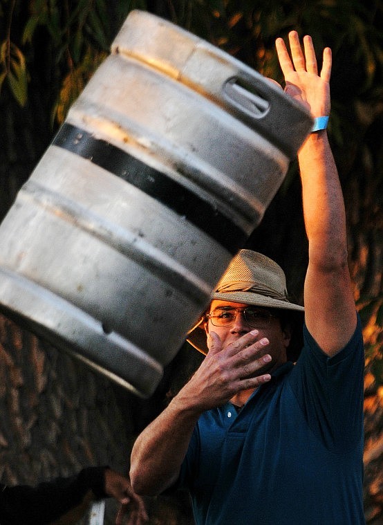 Ryan McNeil sends an empty keg flying through the air.