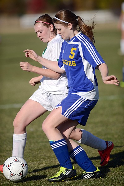 &lt;p&gt;Whitefish freshman Anna Peterson (9) and Libby sophomore Kasie Berget (5) battle for possession of the ball during the first half of their playoff game on Tuesday afternoon in Whitefish. Whitefish won the match up 8-0.&lt;/p&gt;