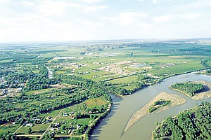 <p>An undated photo shows an aerial view of the confluence of the Tongue and Yellowstone Rivers at Miles City. A legal clash over water rights on the arid Northern Plains is bound for trial as attorneys for Montana press their case that Wyoming farmers and oil and gas companies are sucking too much water from tributaries of the Yellowstone River. (AP Photo/Billings Gazette, Larry Mayer)</p>