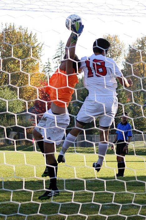 &lt;p&gt;Lakeland goalie Cade Coffey, left, leaps high to prevent a goal from Sandpoint's Joab Logan in Thursday's 4A Region 1 championship game.&lt;/p&gt;