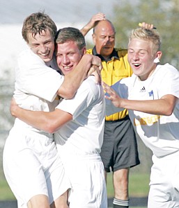 &lt;p&gt;Justus Goldston, center, gets a celebratory hug from teammates Colin Maloney, left, and Isaiah Sickler after scoring in the second half vs. Polson Thursday afternoon. The Loggers went on to win the contest 2-0.&lt;/p&gt;