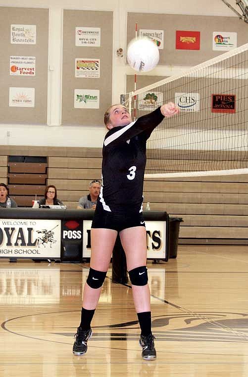 Royal's Alix Ziegler sets the ball for one of her teammates against Wahluke.