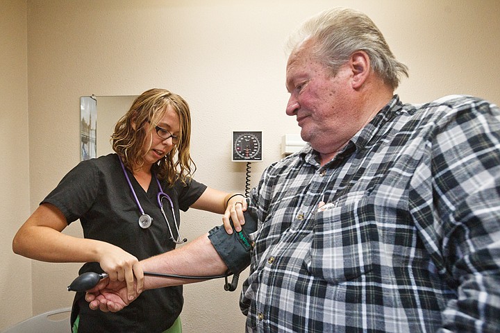 &lt;p&gt;SHAWN GUST/Press Samantha Cline, medical assistant for Dirne Community Health Centers, checks the blood pressure of Hayden resident Rick Grise Tuesday during an office visit. The clinic is planning on consolidating its two Coeur d'Alene locations into one office in January 2012.&lt;/p&gt;