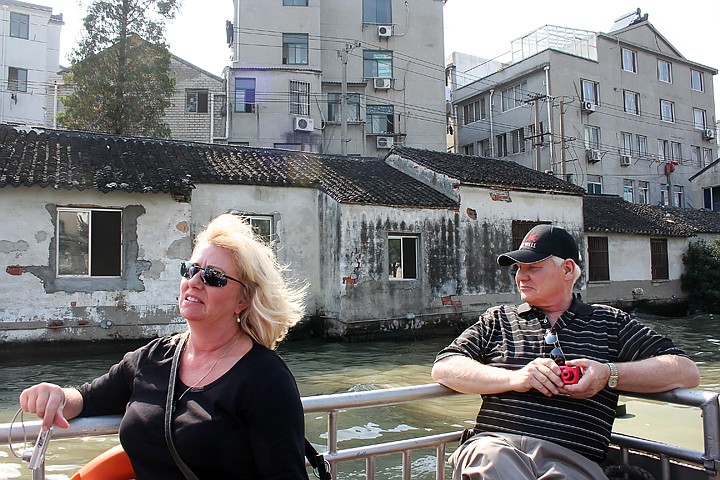 &lt;p&gt;Marilee Wallace and Jerome Parmentier observe the decrepit homes on the waterfront of the Grand Canal in Suzhou, China.&lt;/p&gt;