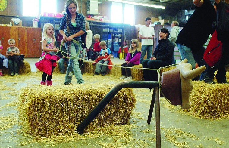 &lt;p class=&quot;p1&quot;&gt;Flathead High School junior and vocational agriculture student Kylee Gibson helps West Valley School first-grader Bailey Gable, 6, lasso a steer dummy during Heritage Days held recently at H. E. Robinson Agricultural Education Center.&lt;/p&gt;