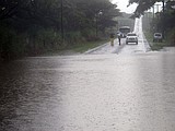 Hawaii hit by winds, rain as hurricane veers west