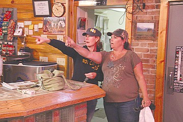 &lt;p&gt;Teammates Terra Flink, left, and Kerry Yeager, right, join forces to decipher a clue at the Second Chance Saloon in Ronan.&lt;/p&gt;