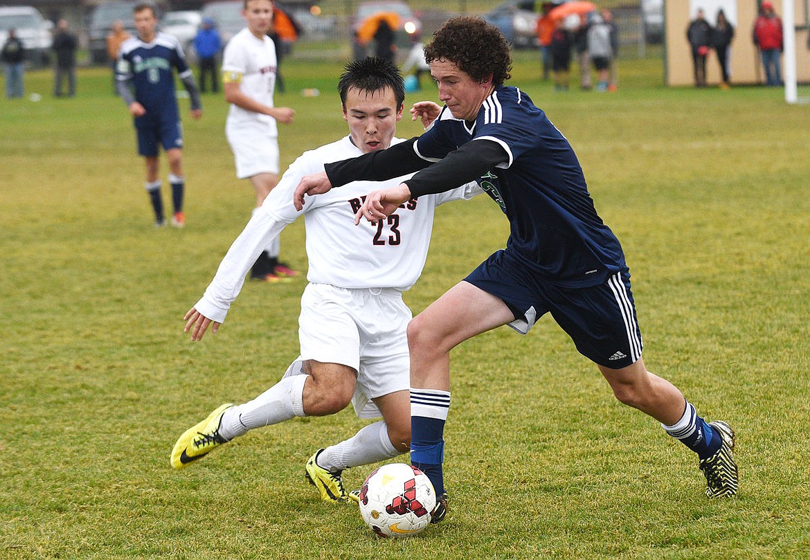 &lt;p&gt;Glacier midfielder Ryan Symmes takes the ball from Flathead defender Tyler Kluesner during the second half of the Wolfpack's 2-1 victory, Thursday at Kidsports Complex. (Aaric Bryan/Daily Inter Lake)&lt;/p&gt;