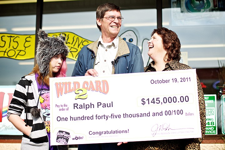 &lt;p&gt;JEROME A. POLLOS/Press Ralph Paul displays his oversized check for $145,000 with his wife Jody and daughter Katie, 12, during a presentation Wednesday by the Idaho Lottery for their win in the Wild Card 2 lottery game.&lt;/p&gt;