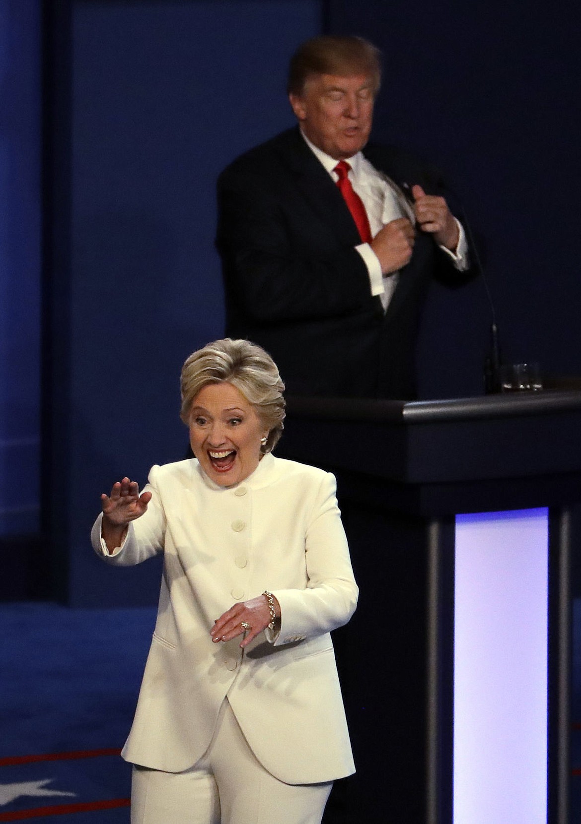 <p>Democratic presidential nominee Hillary Clinton smiles as she walks past Republican presidential nominee Donald Trump at the end of the third presidential debate at UNLV in Las Vegas, Wednesday.</p>