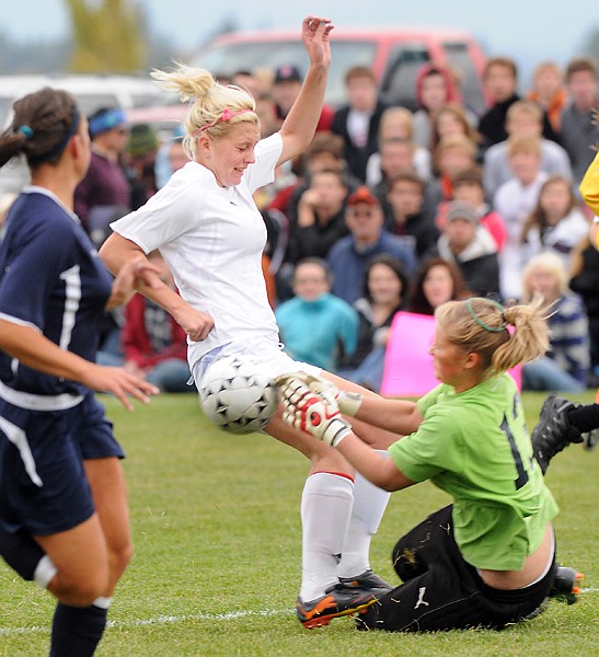 &lt;p&gt;&#160;&lt;/p&gt;
&lt;p&gt;Bailie Poe of Flathead collides with Glacier goalie Shaniya
Carey (13) during a Western AA play-in soccer match on Thursday
afternoon at Kidsports Complex.&lt;/p&gt;
&lt;p&gt;Flathead won 2-0. The Bravettes advance to state tournament play
next week in Helena.&lt;/p&gt;