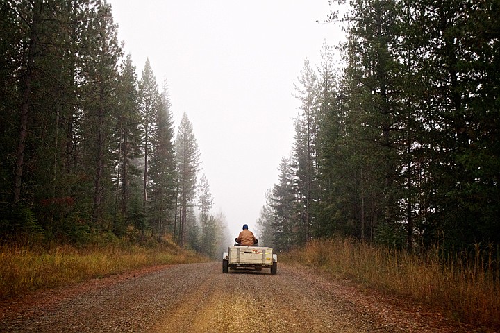 &lt;p&gt;JEROME A. POLLOS/Press Jim Powell travels on a gravel road to his property on his ATV Wednesday morning to harvest firewood and visit with a grouse that he's gained the trust of over the past three years.&lt;/p&gt;