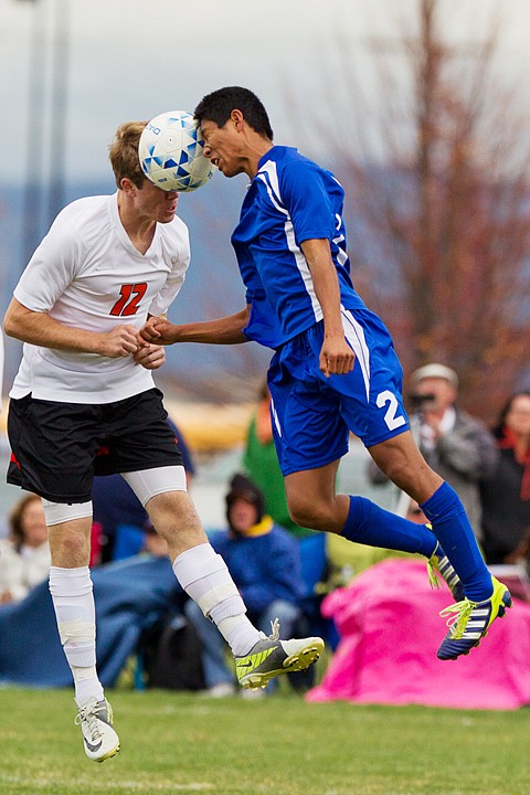 &lt;p&gt;SHAWN GUST/Press Post Falls High School's JD Sullivan (12) goes head-to-head with Skyline's Cole Nukaya Friday during the 5A State Soccer tournament semi-final game in Post Falls.&lt;/p&gt;