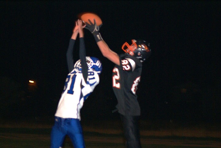 Tanner Ostrum snatches the ball away from a shorter Mission defender.