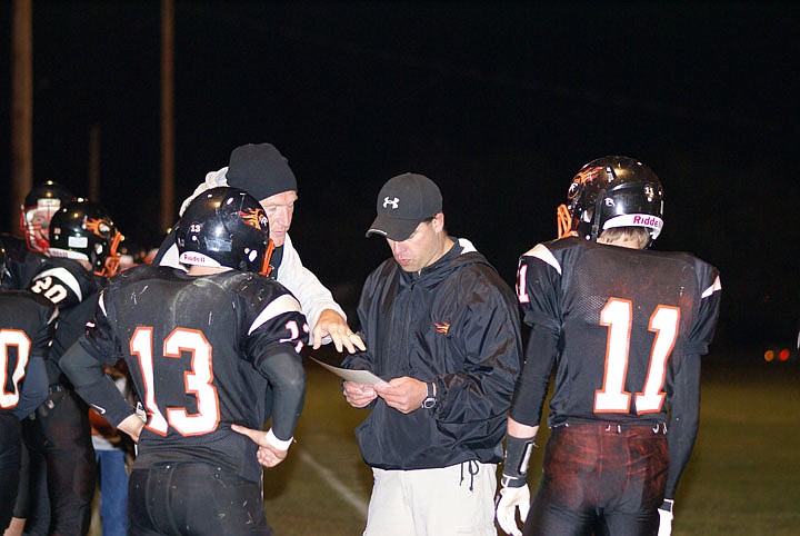 Coach Lawson calls a play in the huddle.