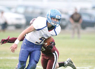 <p>Sophomore Tim Carvey drives for a first down first quarter vs. Troy Oct. 2.</p>