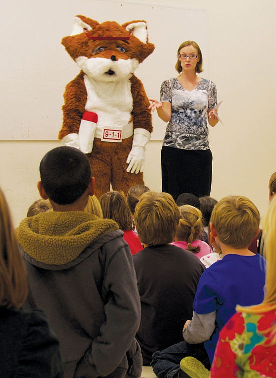 &lt;p&gt;Dispatcher Nikki Stephan is joined by the Red E. Fox at a presentation on the proper use of 911 at Hedges Elementary School on Oct. 9. (Tim Tepas photo)&lt;/p&gt;&lt;div&gt;&#160;&lt;/div&gt;