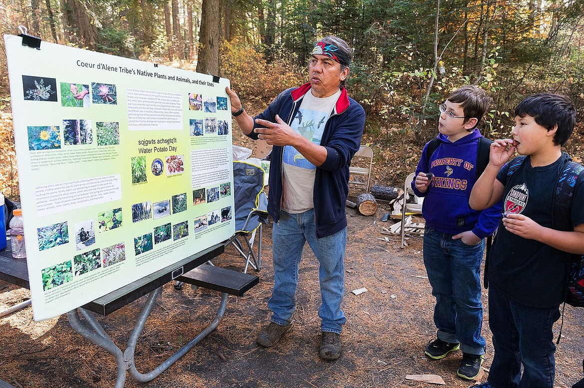 &lt;p&gt;Mark Stanger, a Coeur d&#146;Alene Tribe elder, talks about native plants and animals to students as fifth-graders Gavin Sailor and Kai McKinnon, far right, enjoy huckleberries and smoked salmon.&lt;/p&gt;