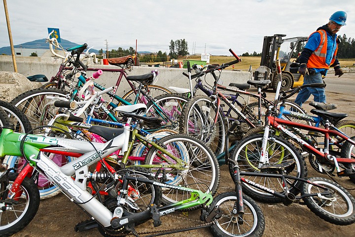 &lt;p&gt;SHAWN GUST/Press Steve Vaday, recycler for the Kootenai County Solid Waste Department, walks passed a pile of discarded bicycles Monday during his at the transfer station on Ramsey Road in Coeur d'Alene. The bikes are restored and made available at little or no cost by Jim Watson of Dalton Gardens.&lt;/p&gt;