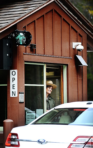 <p>Brenda Woll welcomes visitors into Glacier National Park on Thursday, October 17. (Brenda Ahearn/Daily Inter Lake)</p>