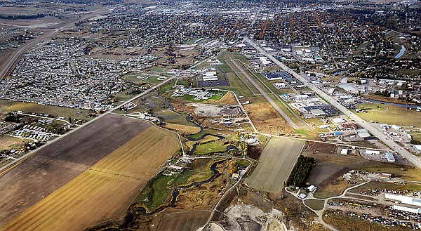 <p>This aerial view of Kalispell City Airport on Monday looks north toward Kalispell. The runway at the airport parallels U.S. 93.</p>