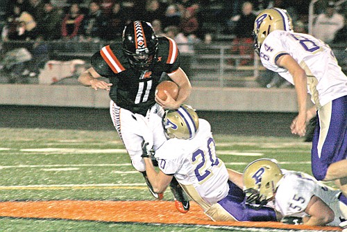 Polson sophomore Will Davey gets ahold of Ronan junior quarterback Robbie Gauthier last Friday in Ronan.