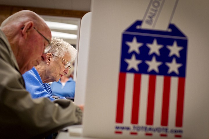 &lt;p&gt;Lois Durand and her husband Glen fill out their absentee ballots Wednesday at the Kootenai County Elections Office in Coeur d'Alene.&lt;/p&gt;