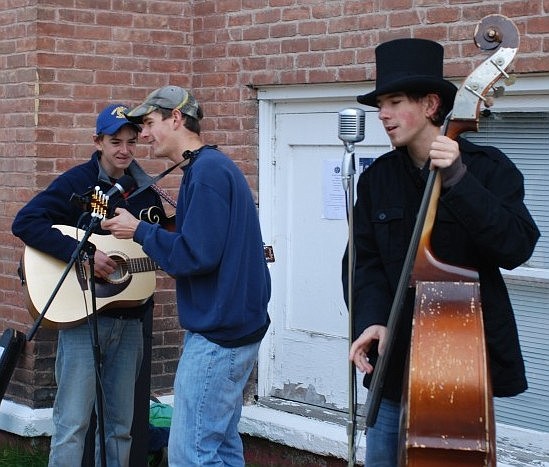 Wyatt plays guitar, Kenlay plays a mandolin and Roman plays bass as the Zylawy brothers perform at the We Care event last Saturday, Oct. 16.