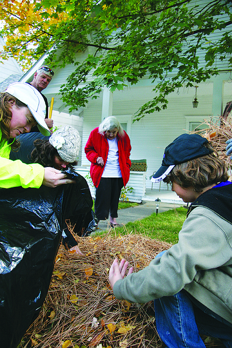 &lt;p&gt;Jane Marker, in background in red, admires the yard work of members of two local triathlon clubs and their families at her home on Saturday. On the left from front are Stephanie Hallock, Connie Price and Tom Aylward and on the right is 11-year-old Mason Stephens. The clubs &Ntilde; CDA TRI and Lake City Tri &Ntilde; have joined forces to help local seniors in need and those with disabilities after Marker, 85, of Coeur d&Otilde;Alene, who suffers from osteoporosis bone disease, was seen cleaning up her neighbor&Otilde;s yard.&lt;/p&gt;